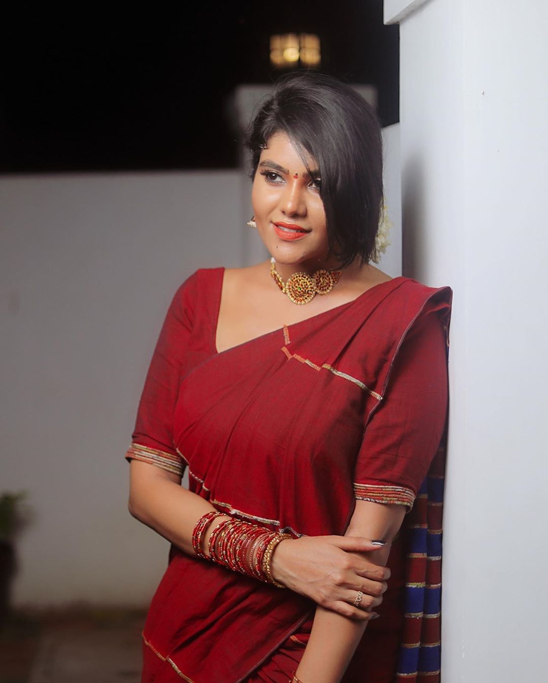 South indian actress Nivisha looking glorious in red saree