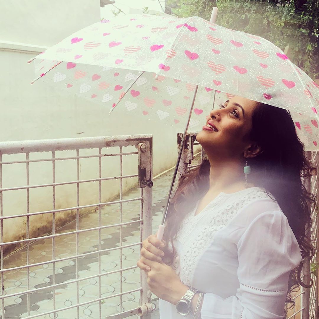 Malayalam actress Poojitha menon in hot photos with umbrella