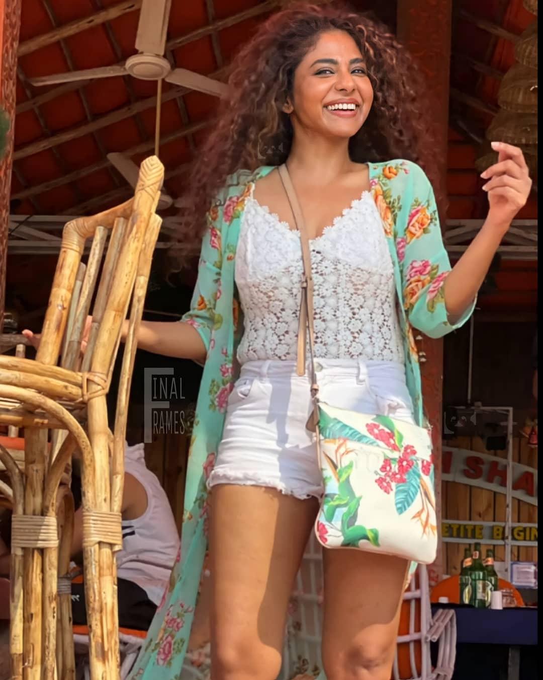 South indian actress Poornima indrajith in shorts looking very glamorous photos gallery