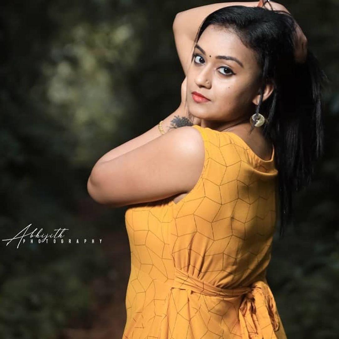 Yellow dress hot photos gallery | Varada Jishin latest hot and sexy photoshoot