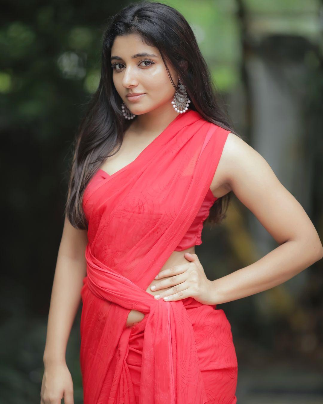 Red Saree hot and sexy stills | Mirna Menon looking very glamorous photos