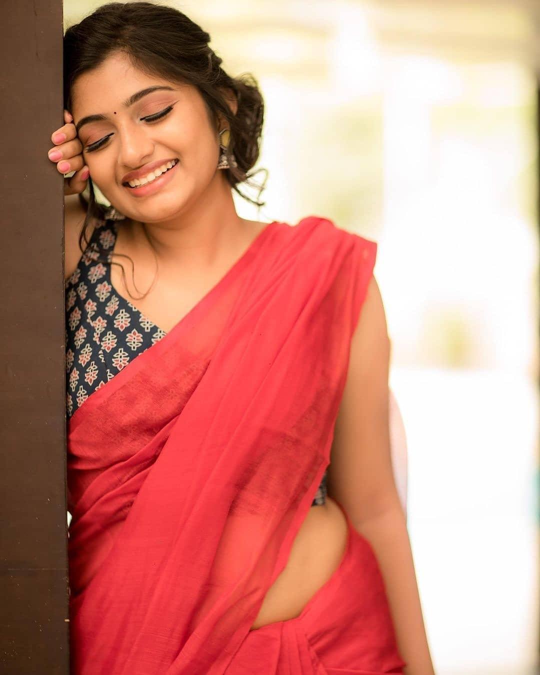 Archana R looking very glamorous photos | Archana R in red color saree photos