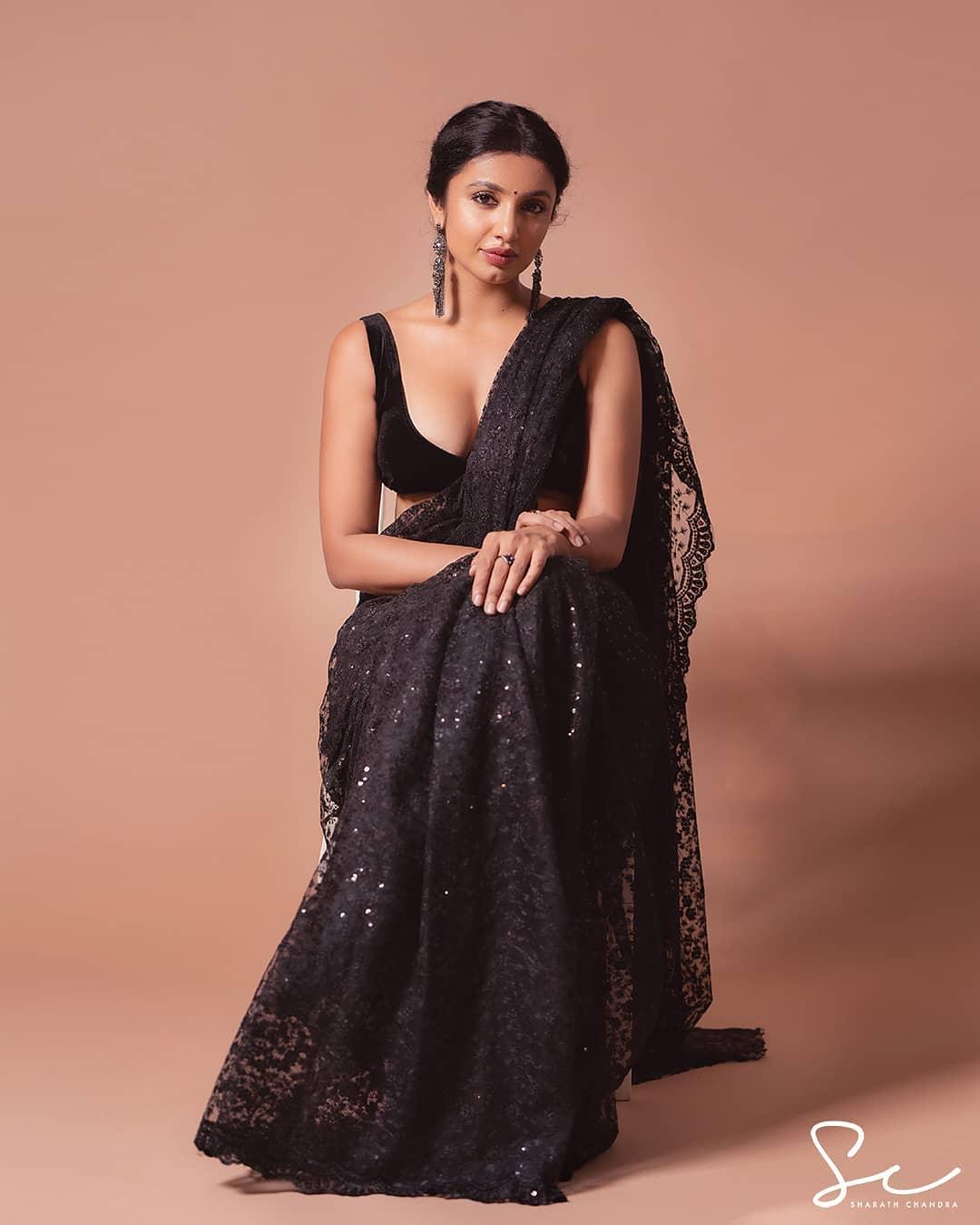 Tejaswi Madivada in black saree showing cleavage photo gallery | Glamorous and cute photos