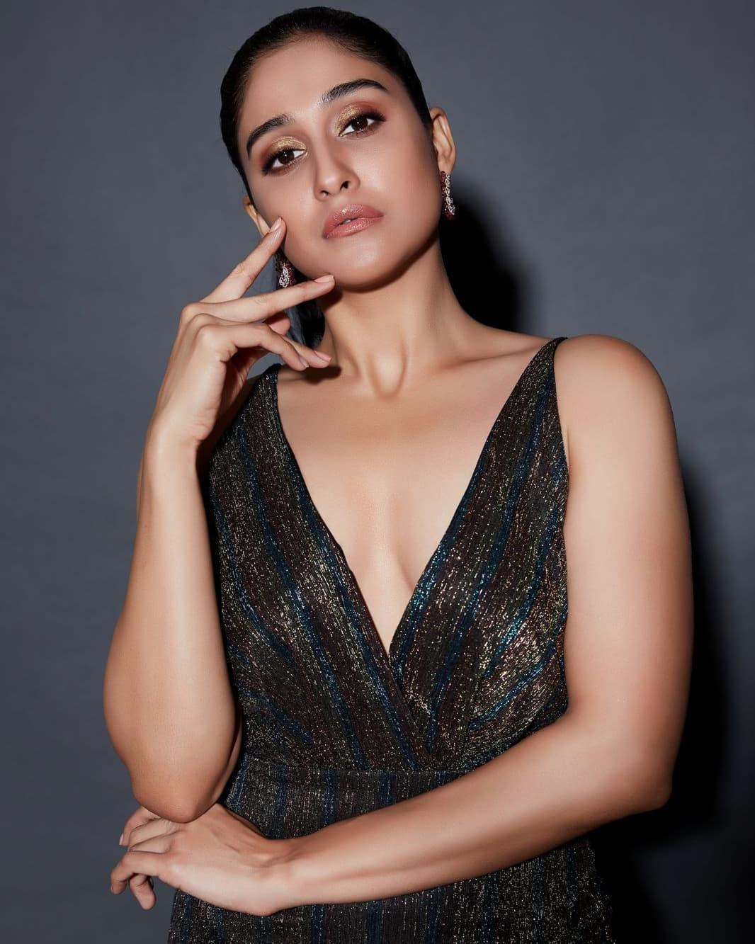 Regina Cassandra in black dress hot photos | looking very glamorous photos gallery