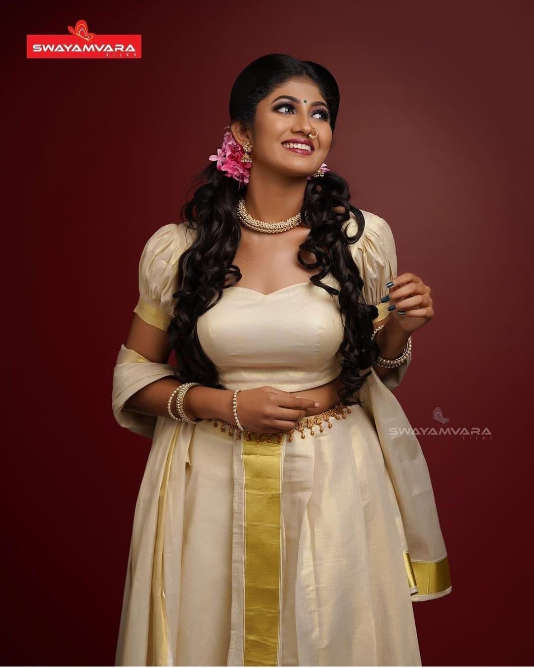 South Indian actress Drishya Raghunath in pavada and blouse hot photos | latest hot and spicy photos gallery