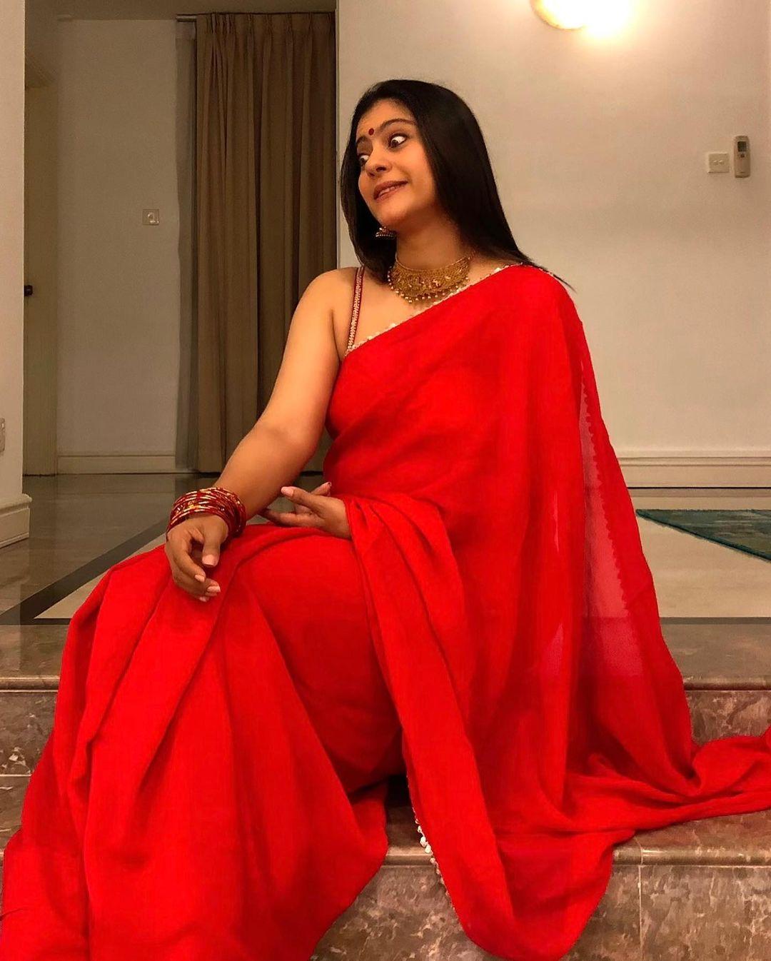Bollywood actress Kajol devgan in red saree and sleeveless blouse hot photos | looking very glamorous photos