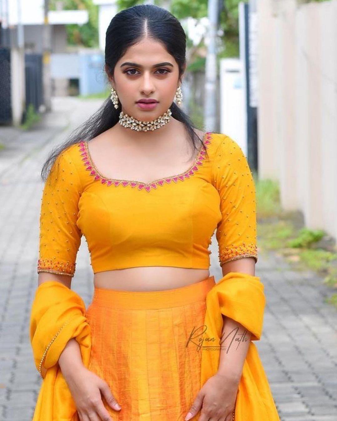 Malayalam actress Nayanthara Chakravarthy in pavada and blouse hot photos | Nayanthara Chakravarthy very glamorous and cute photos