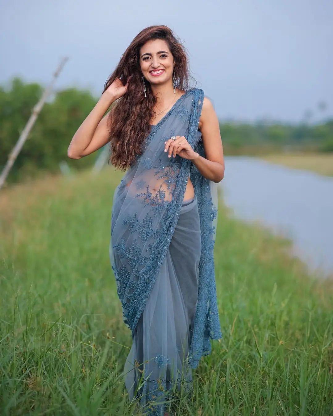 Angel Thomas in transparent saree hot photos | Angel Thomas looking very glamorous and cute photos