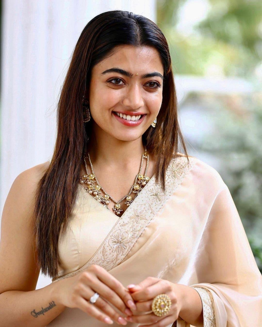 National crush Rashmika Mandanna in white saree hot photos gallery| looking very attractive and cute stills