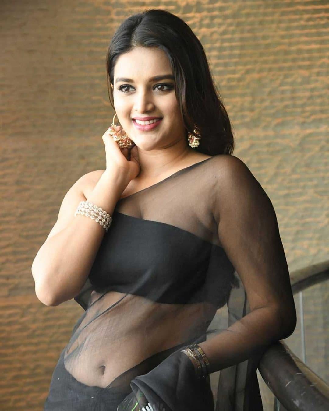 Nidhhi Agerwal showing navel and cleavage in black transparent saree photos | exclusive hot and spicy photos gallery