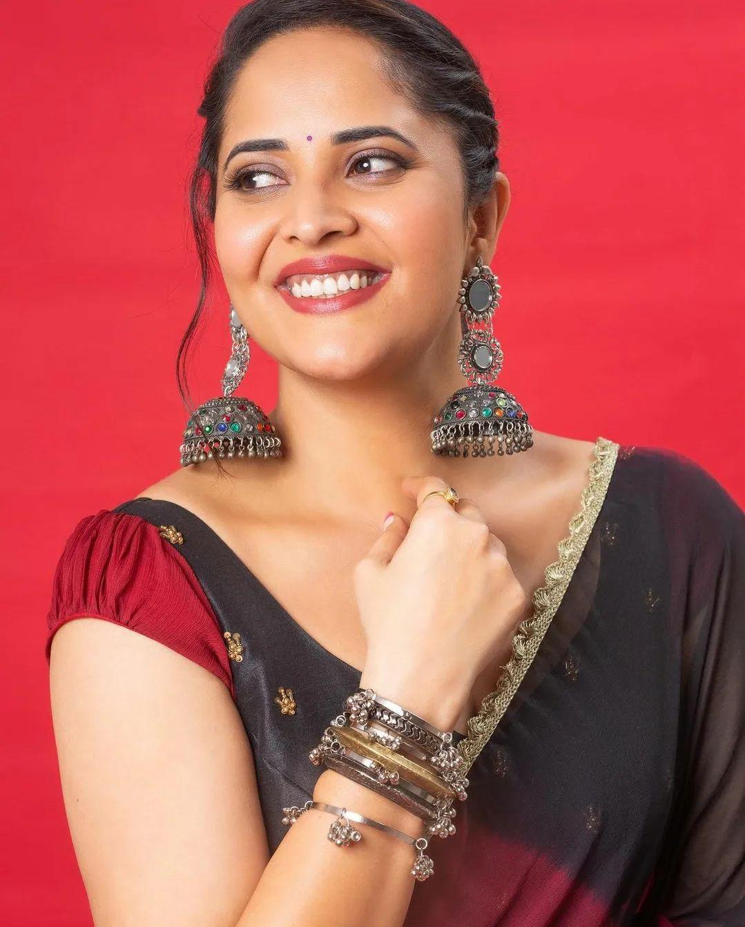 Anasuya Bharadwaj in transparent red saree hot photos gallery | beautiful and attractive hot photos gallery
