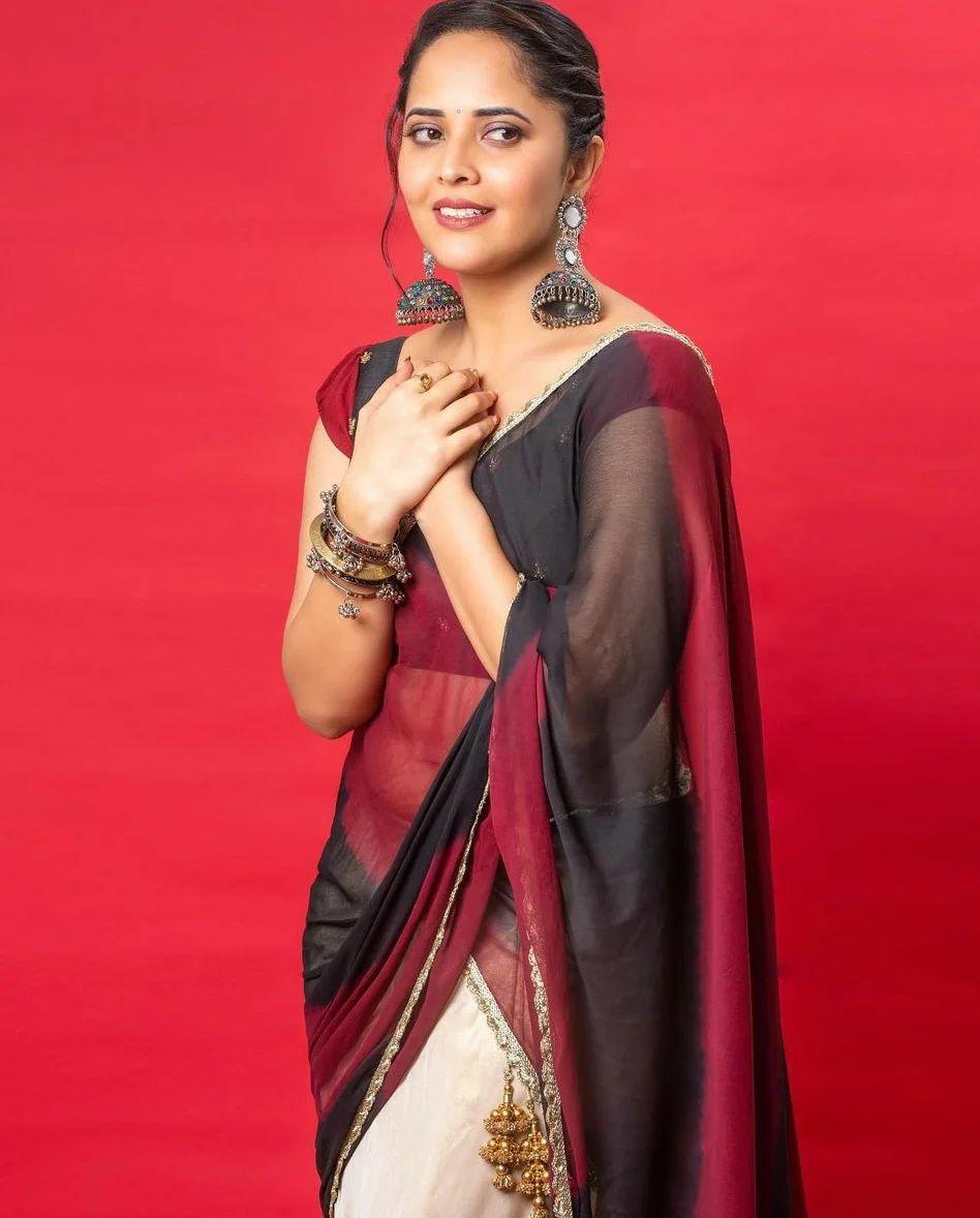Anasuya Bharadwaj in transparent red saree hot photos gallery | beautiful and cute photos gallery