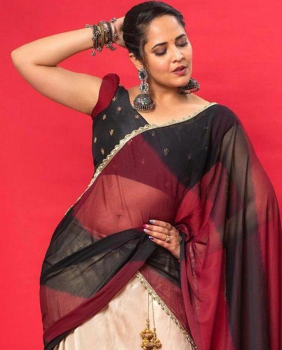 Anasuya Bharadwaj in transparent red saree hot photos gallery | exclusive hot and sexy photoshoot