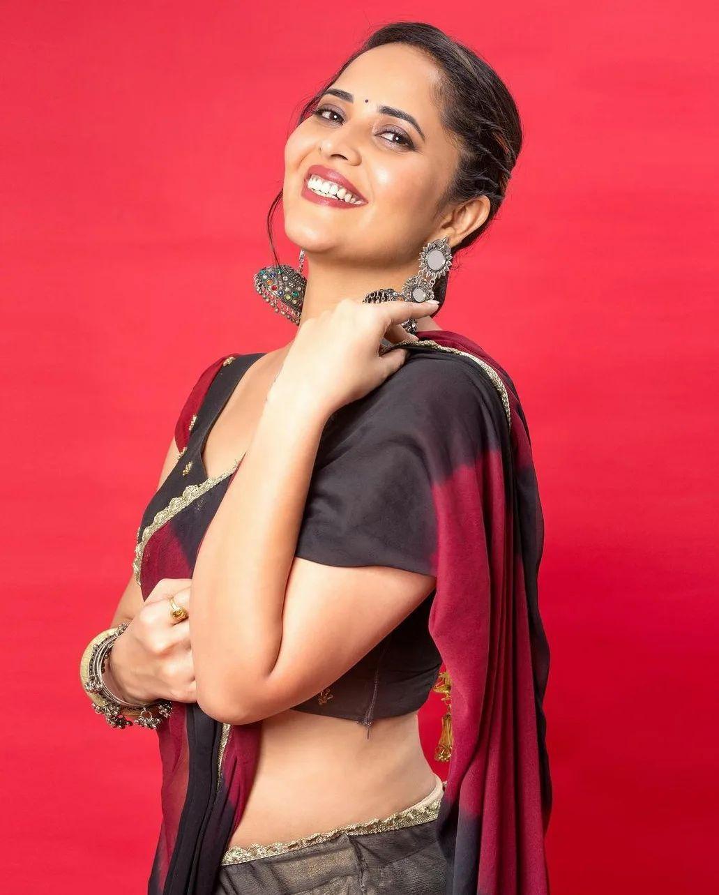 Anasuya Bharadwaj in transparent red saree hot photos gallery | looking very attractive and cute stills