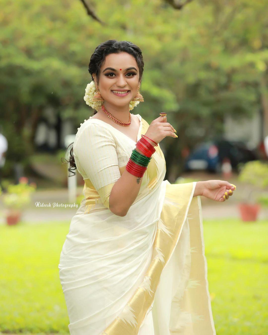 Malayalam actress lakshmi nakshathra in kasavu saree hot photos | latest hot and sexy photoshoot