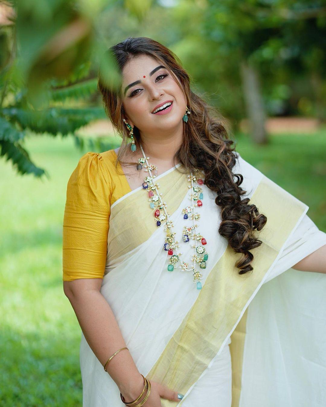 Aparna thomas in vishu special Kerala saree hot photos gallery | looking very attractive and glamours picture