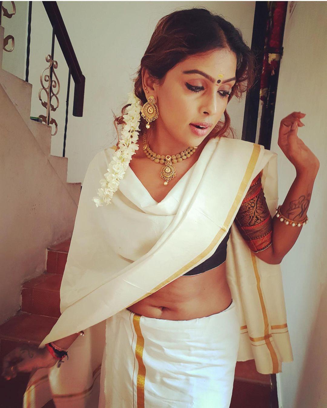 Sri Nikha exposing Navel in Kasavu Saree photos gallery | beautiful and cute stills