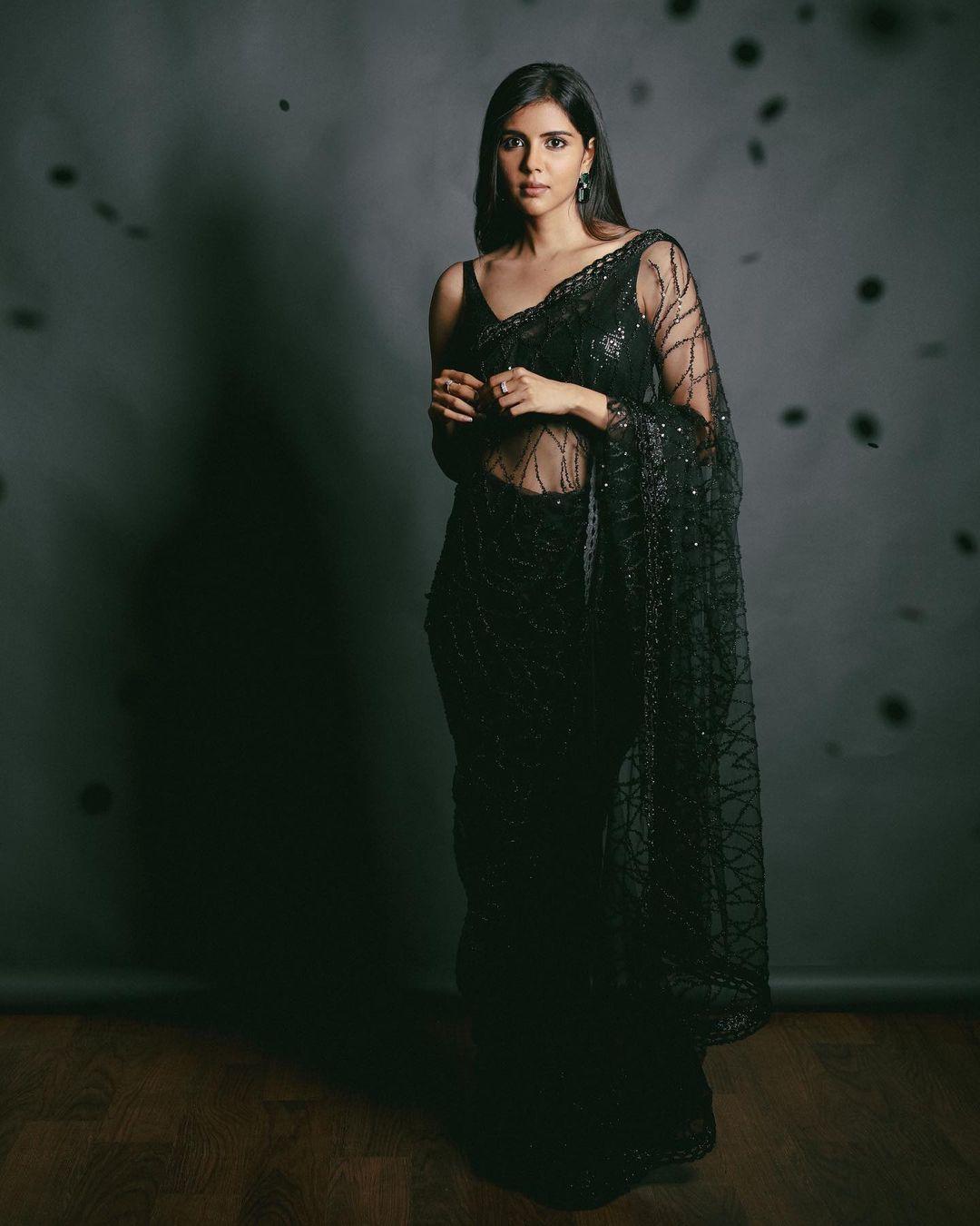 Kalyani Priyadarshan in black transparent saree photos gallery | looking very attractive and cute stills