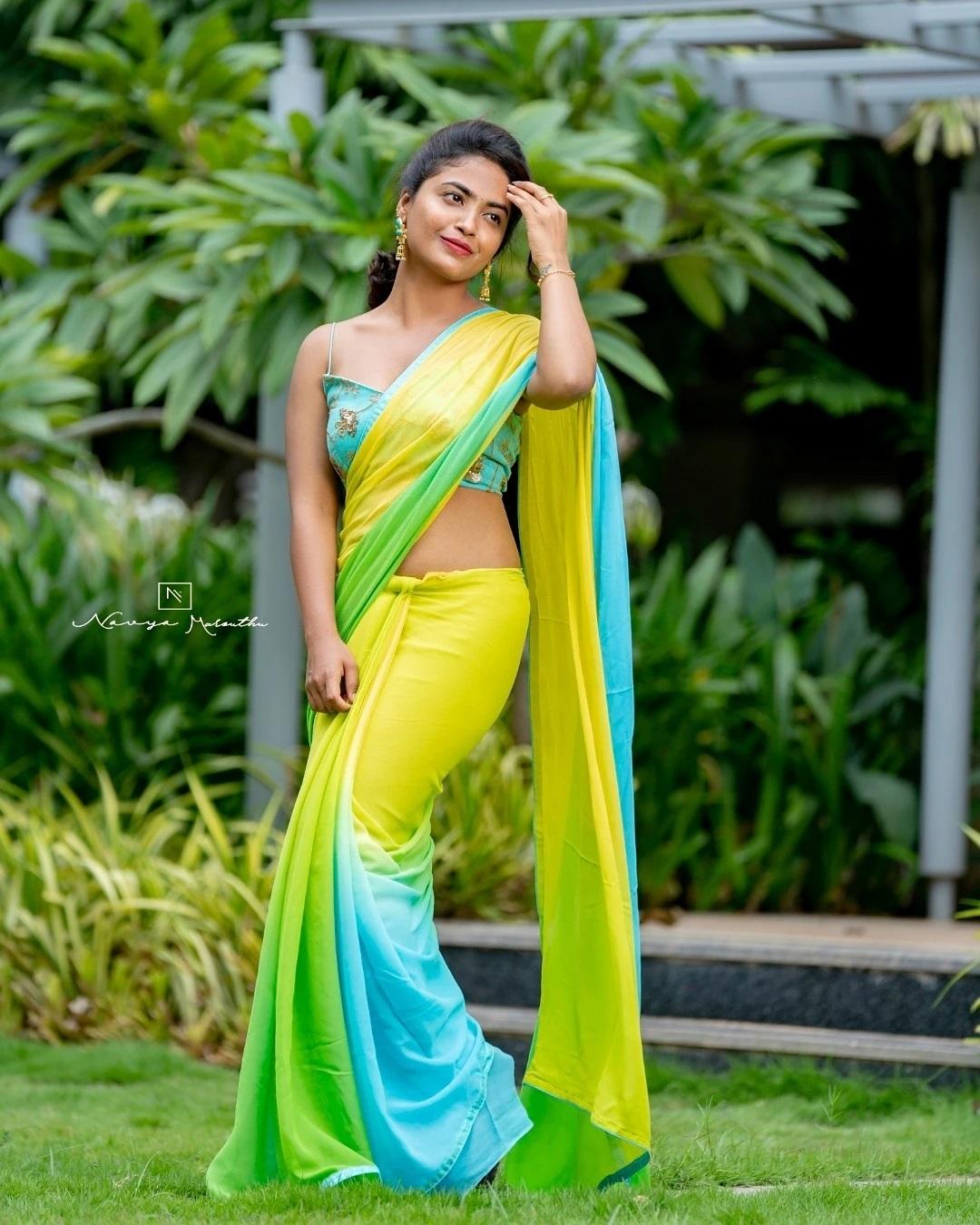 Alekhya Harika in Yellow color sleeveless blouse and saree hot photos | hot and sexy photoshoot