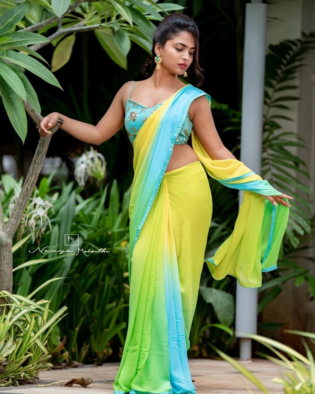 Alekhya Harika in Yellow color sleeveless blouse and saree hot photos | latest hot and spicy stills