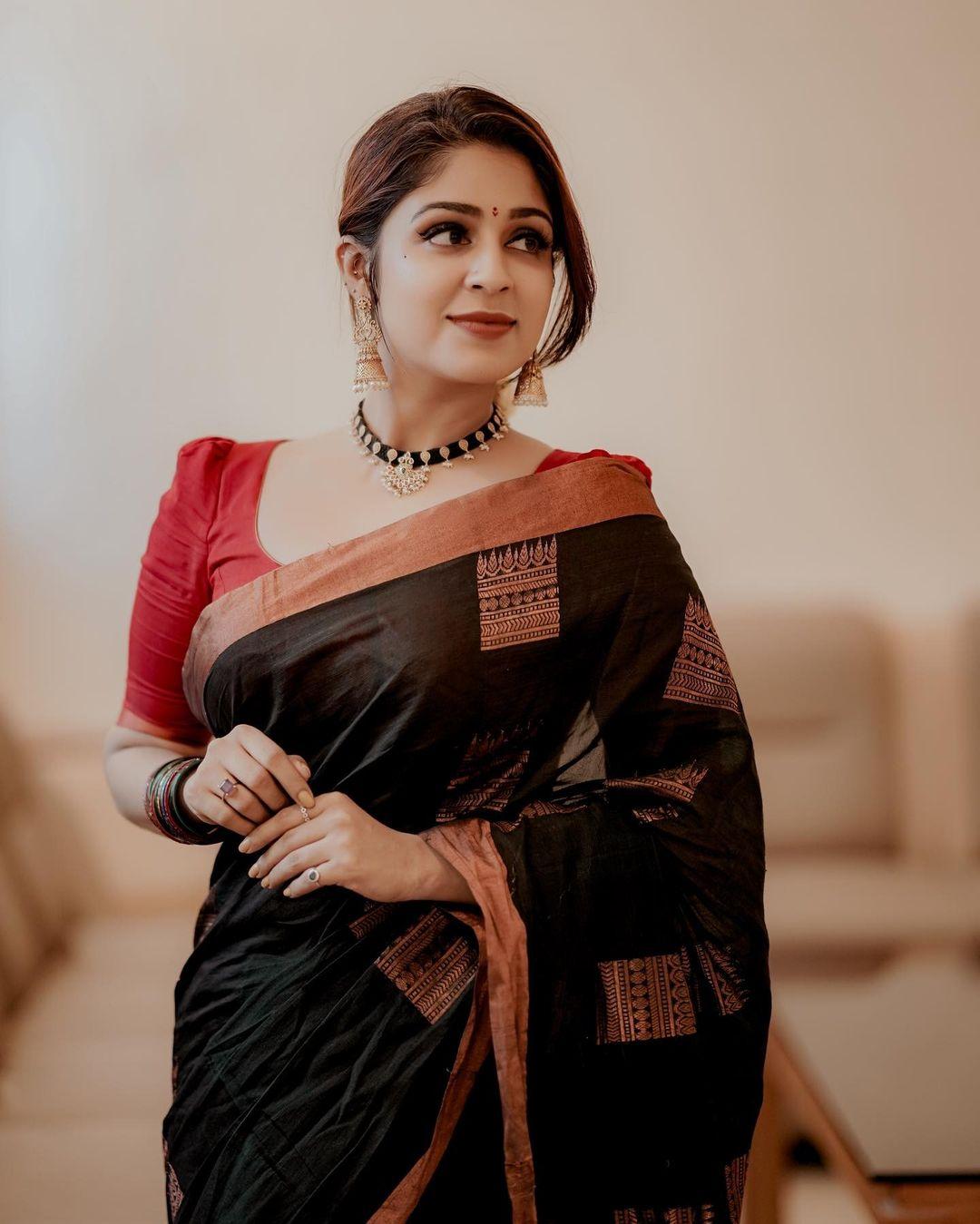 Exclusive hot and sexy photoshoot| Malavika Wales in red and black saree hot photos