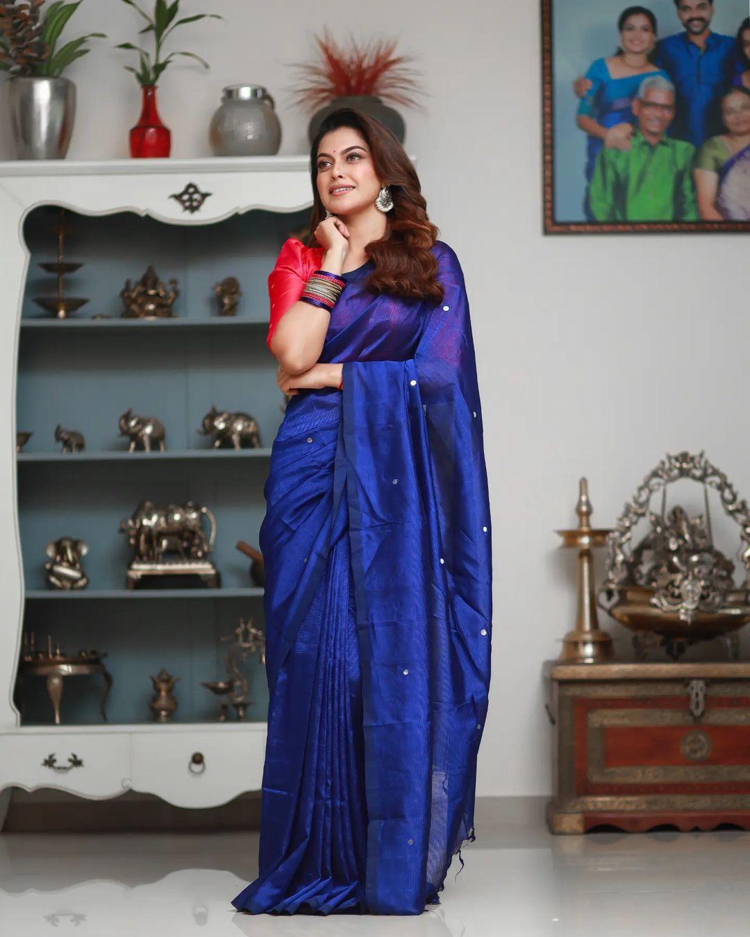 Looking very attractive and cute stills | Anusree in blue shade Saree hot photos