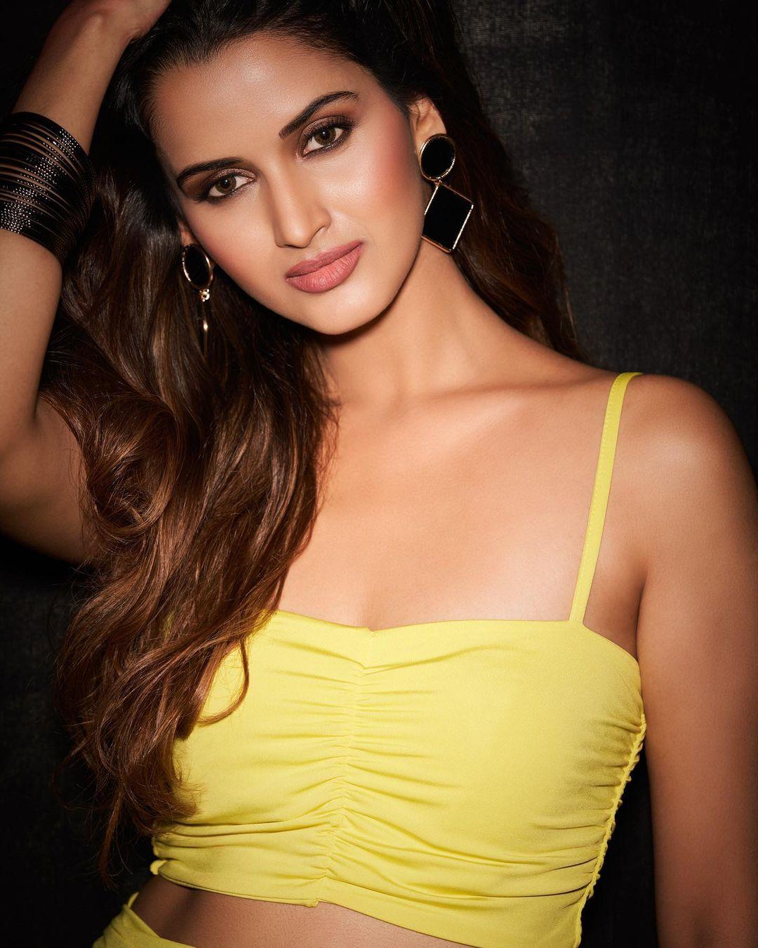 Very glamours and cute stills | Shivani Jadhav wearing yellow dress hot photos
