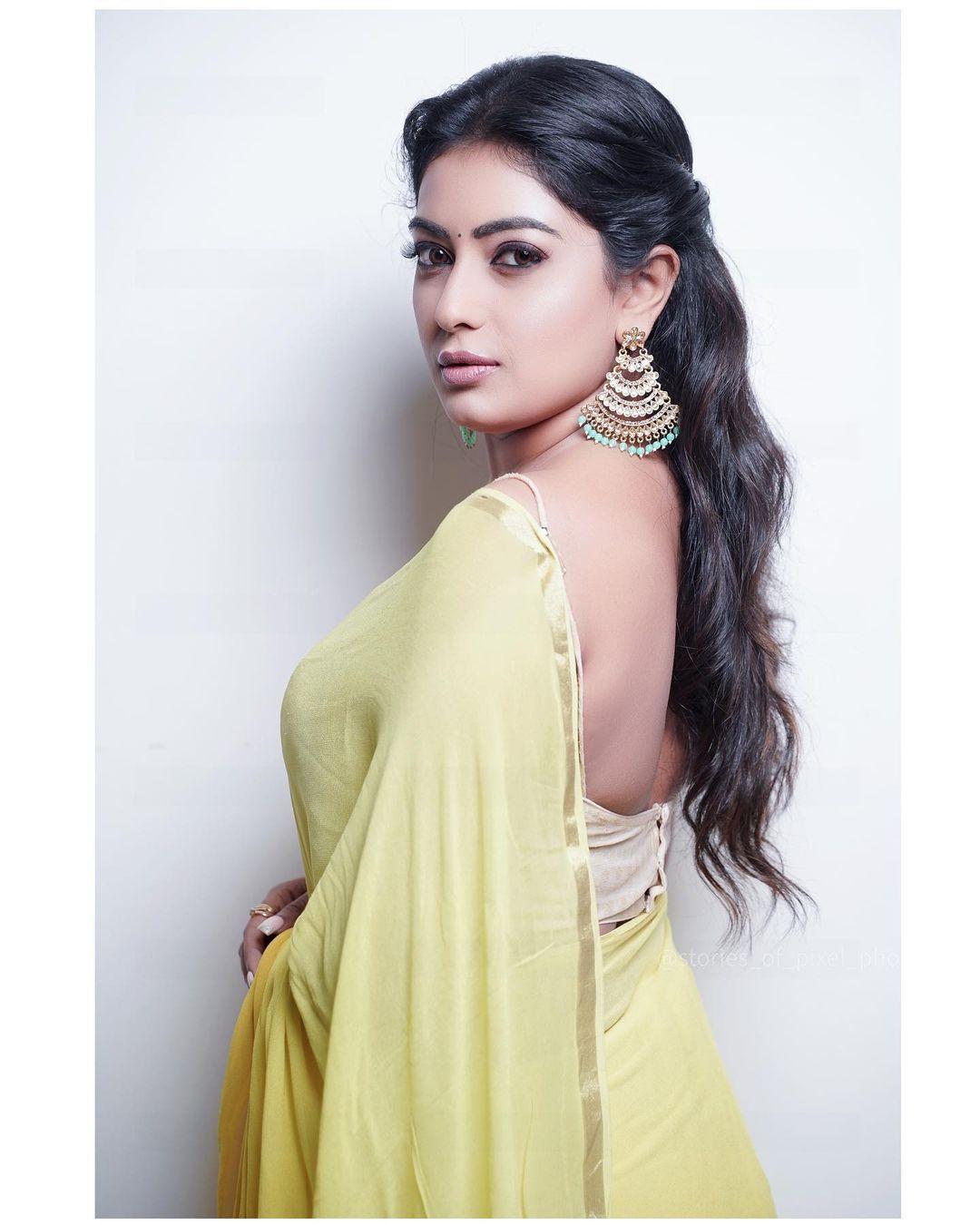 Exposing hot photos | Sonika gowda in sleeveless blouse with yellow transparent saree hot photos