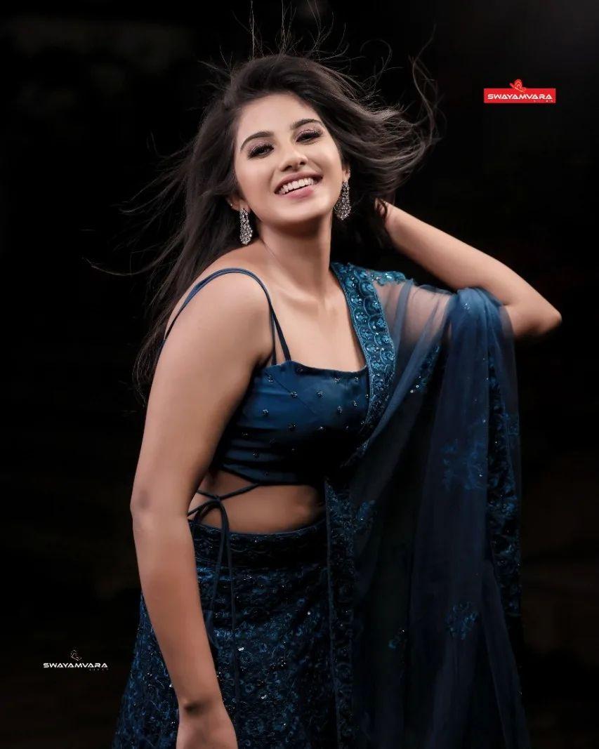 Beautiful and cute stills | Maneesha Mahesh in black saree hot and sexy photoshoot