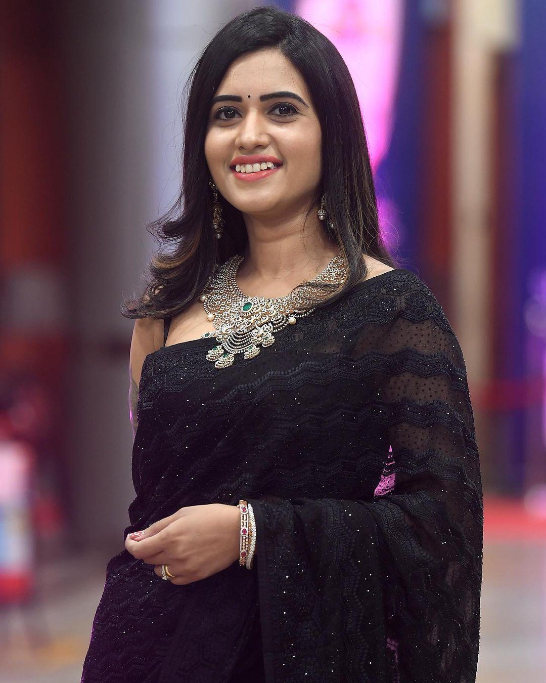 Beautiful and cute stills | Sravanthi Chokkarapu in black transparent saree hot photos