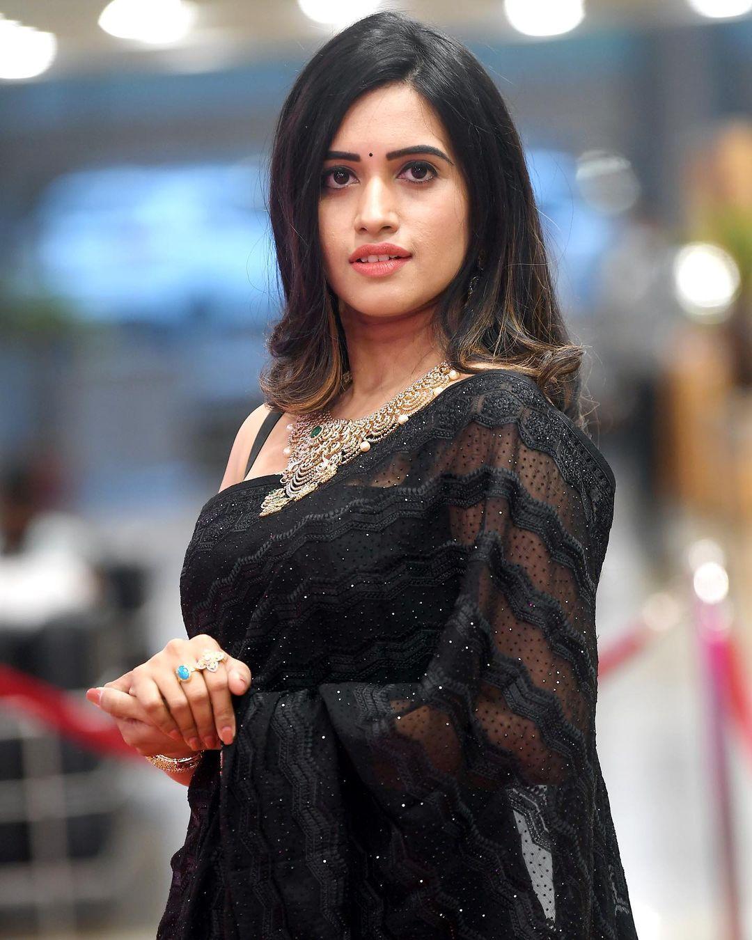 Looking very hot photos | Sravanthi Chokkarapu in black transparent saree hot photos