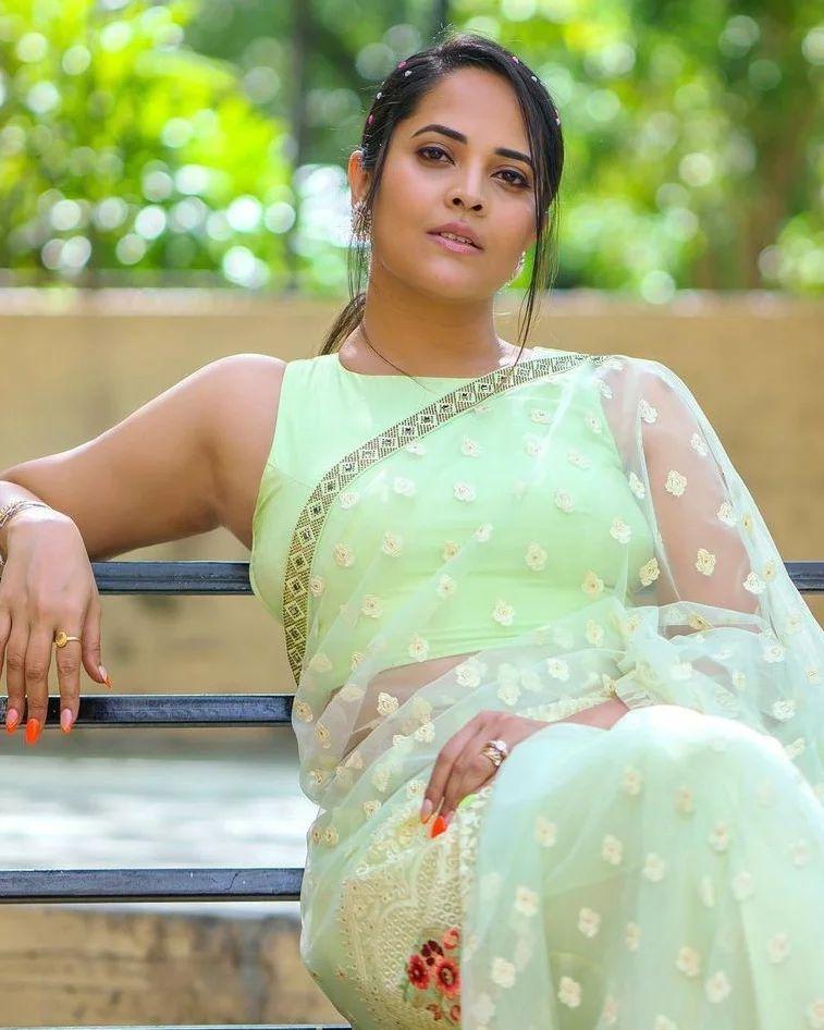 Glamours and cute stills | Anasuya Bharadwaj in yellow transparent saree hot photos
