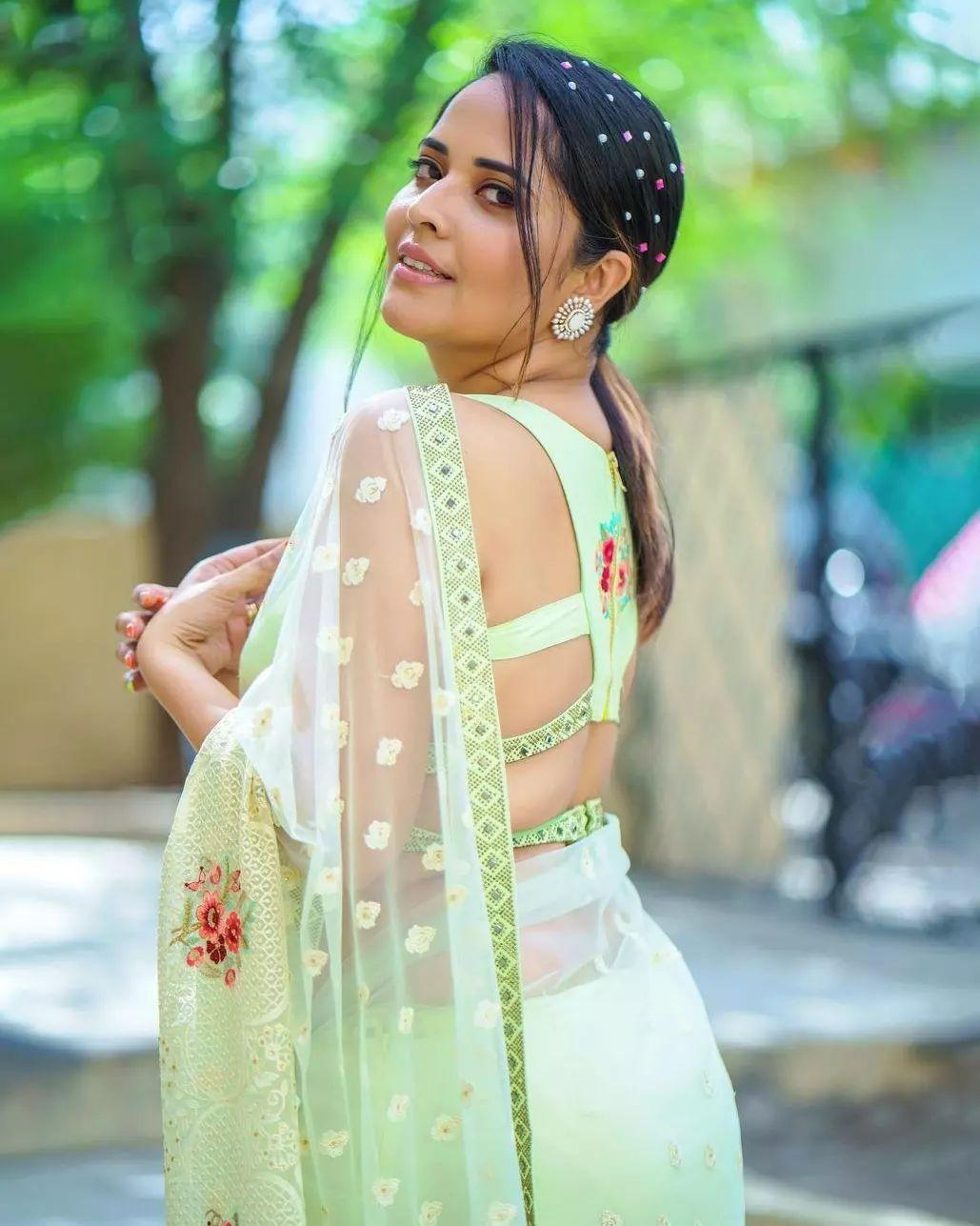 Saree hot photos | Anasuya Bharadwaj in yellow transparent saree hot photos