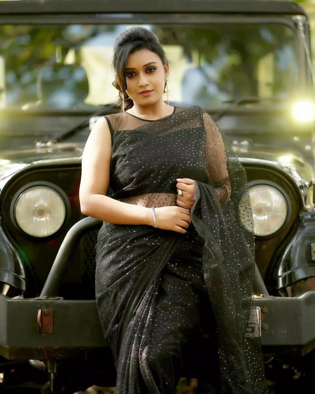 Beautiful and glamours photos | Varada in black transparent saree hot photos
