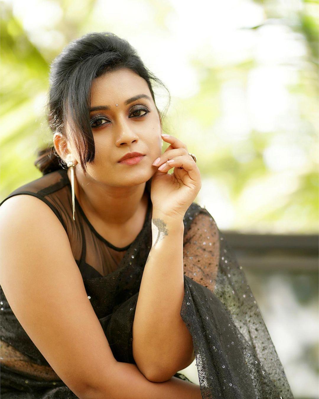 Exclusive hot and sexy stills | Varada in black transparent saree hot photos
