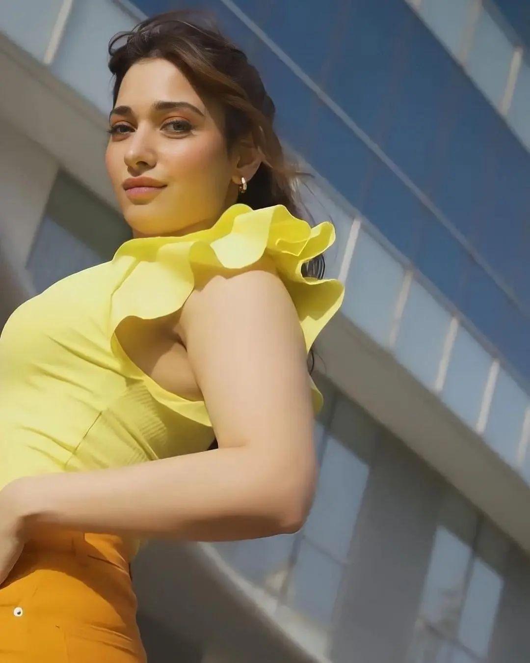 Beautiful and glamours photos | Tamannaah looking very glamours photos in yellow. Dress photos