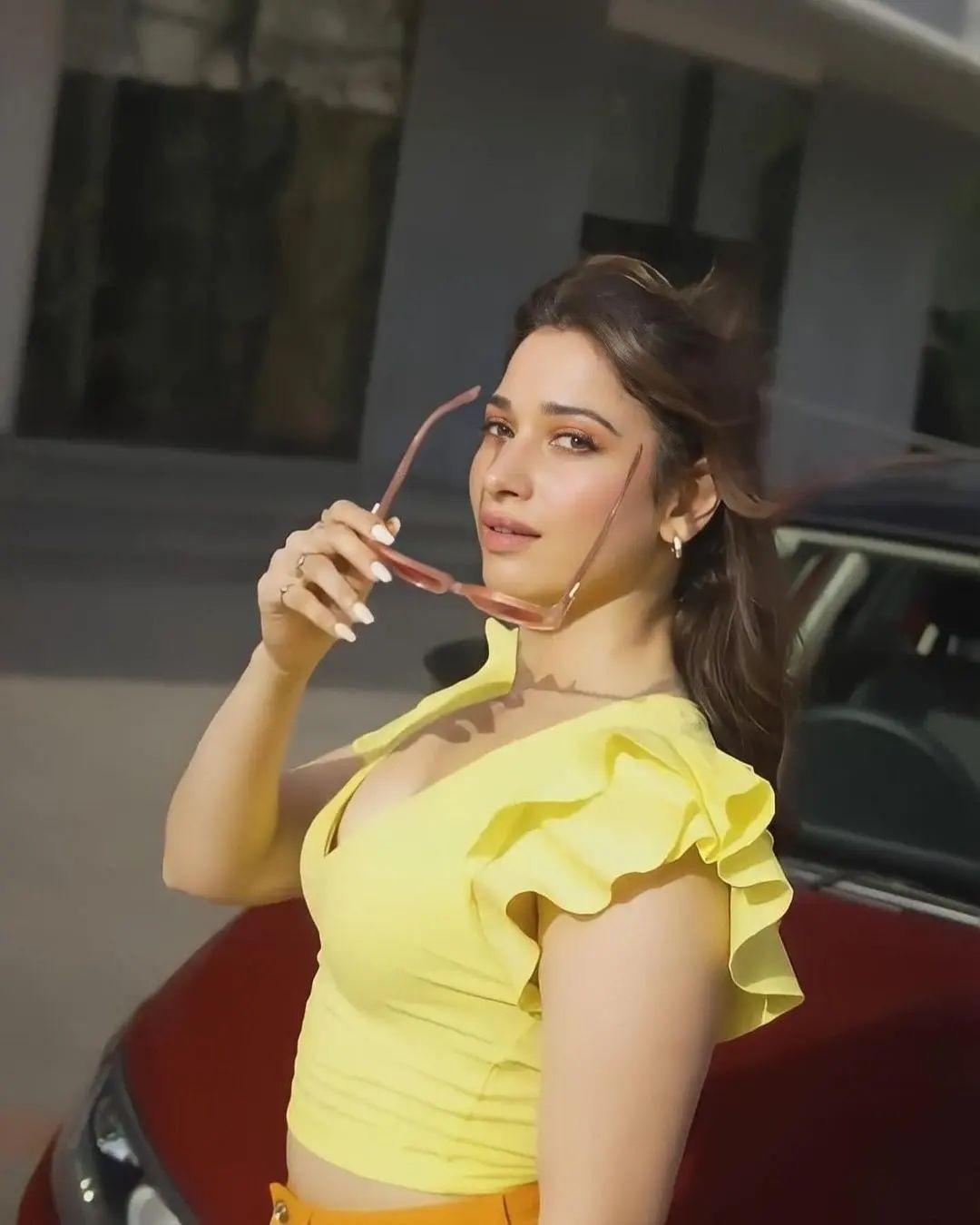 Beautiful and glamours photos | Tamannaah looking very glamours photos in yellow. Dress photos