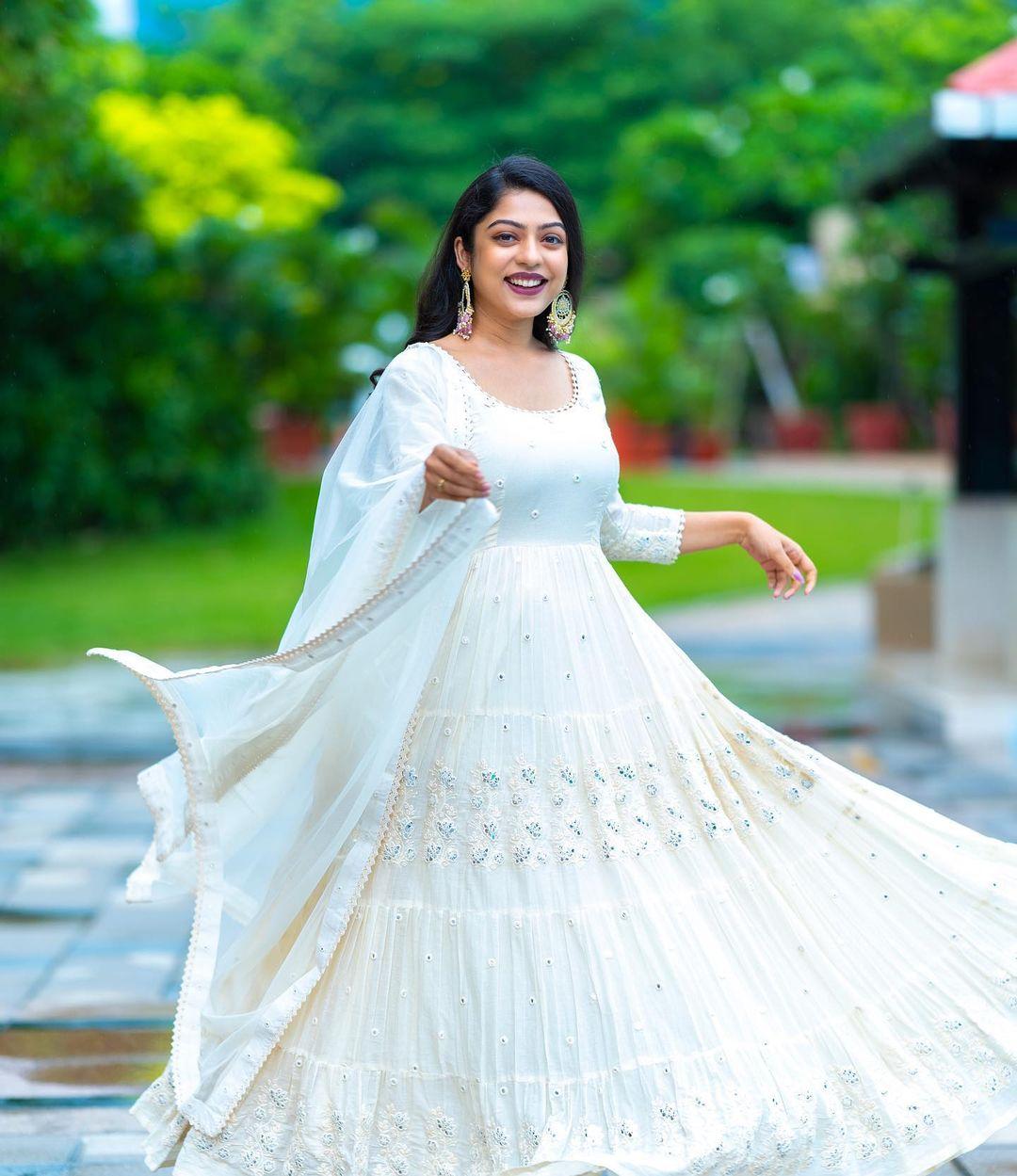 Glamours and cute stills | Varsha Bollamma in white churidhar hot photos gallery