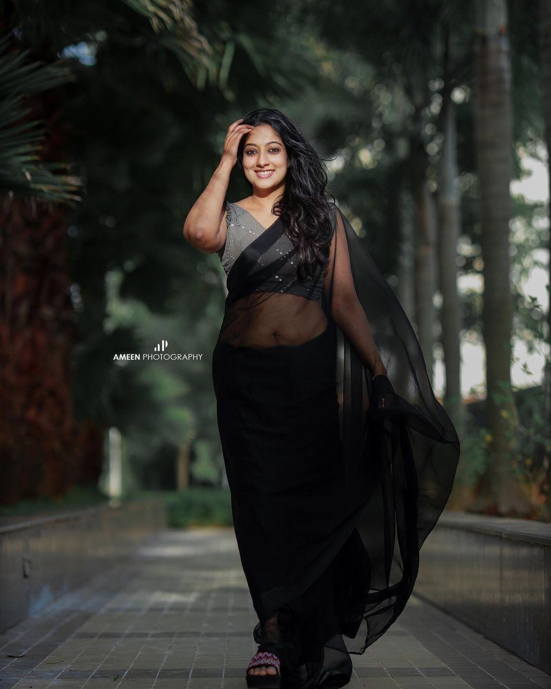 Exposing hot photos| Laya Simpson in black transparent saree hot photos gallery