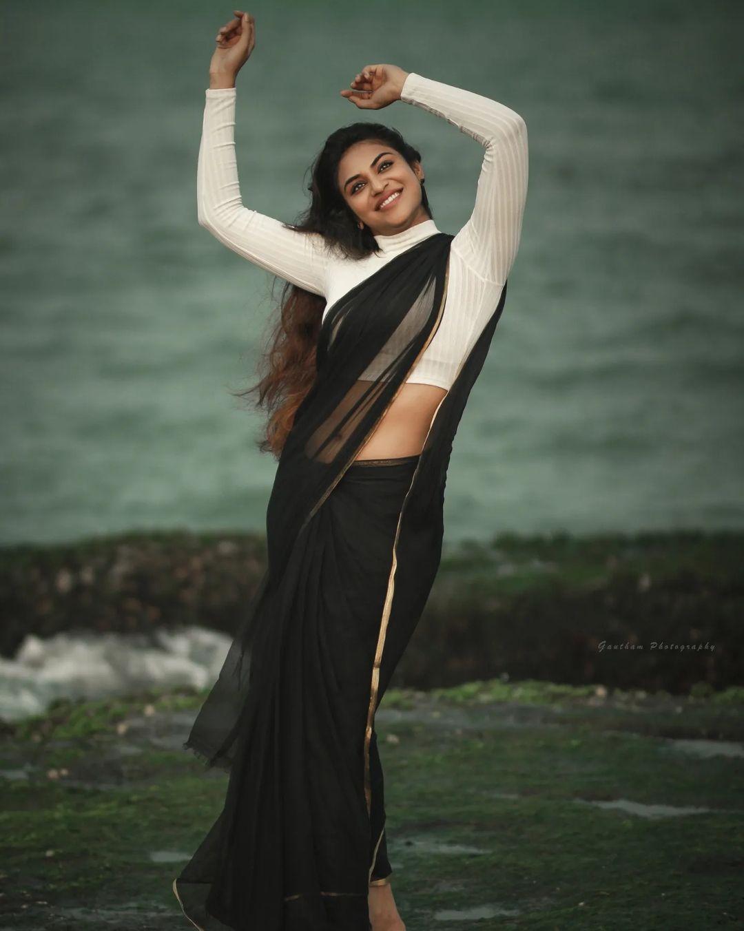 Tamil actress hot photos | Indhuja Ravichandran wearing black Transparent saree hot photos