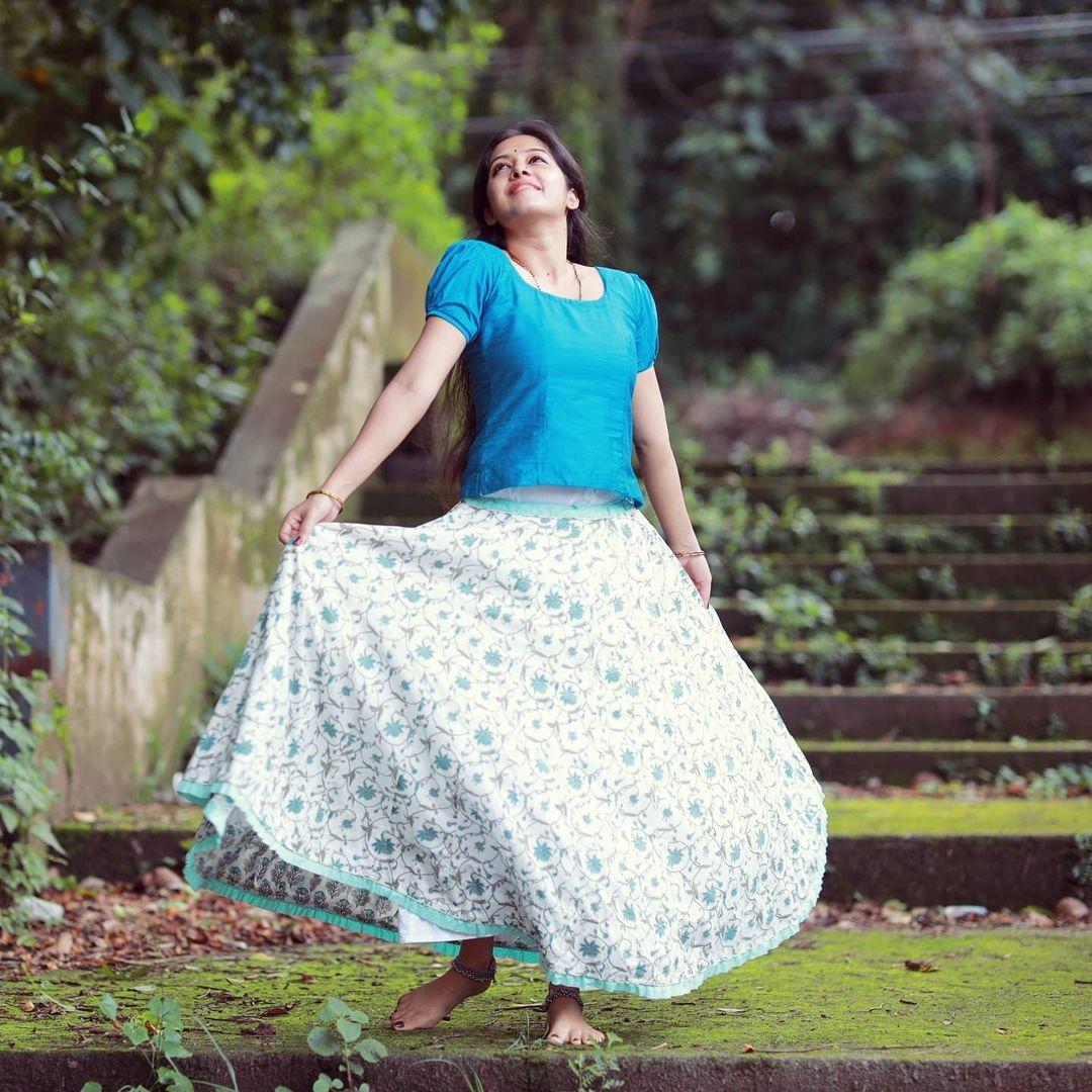 Exposing hot photos gallery | Aadhya Prasad in blue pavada and blouse hot photos