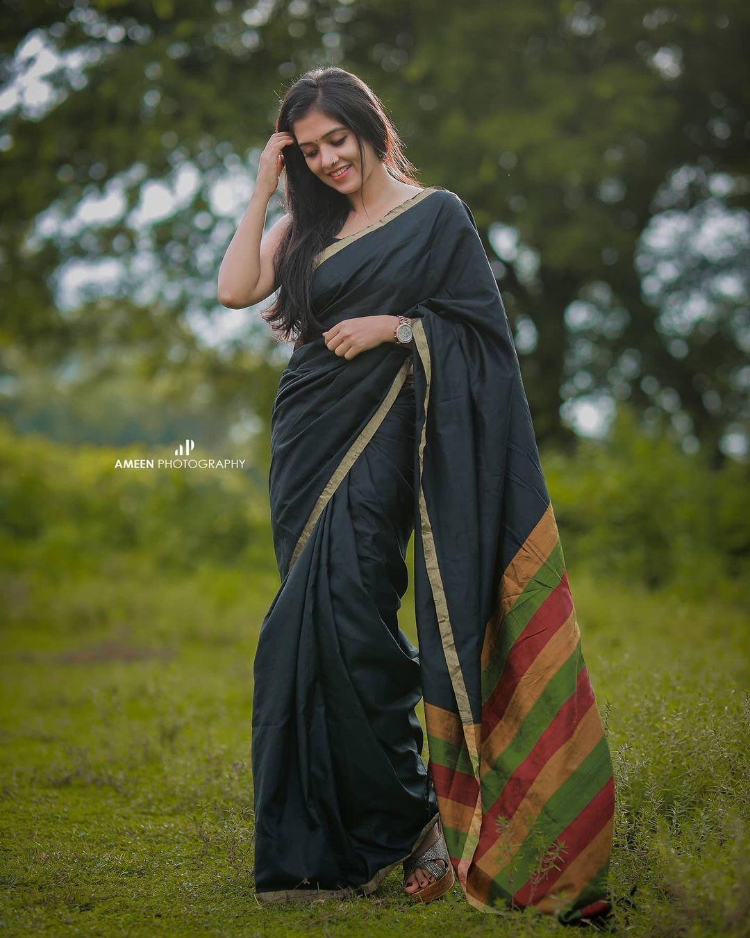 Glamorous and cute stills | Aadhya Prasad in black Transparent saree hot and sexy stills