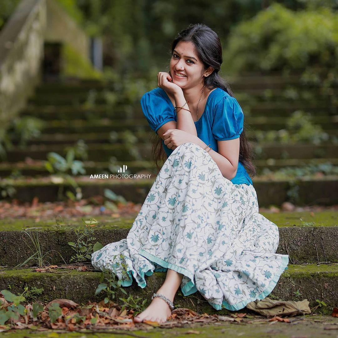Latest hot and spicy stills | Aadhya Prasad in blue pavada and blouse hot photos