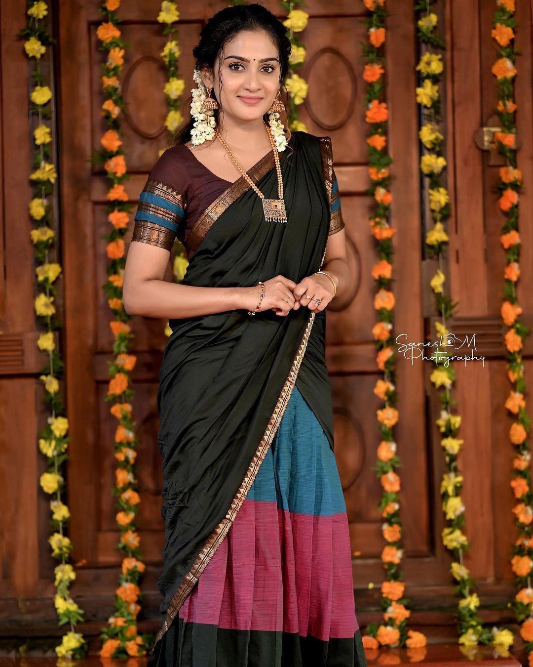 Glamorous and cute stills | Aditi Ravi in black half saree hot and sexy photoshoot