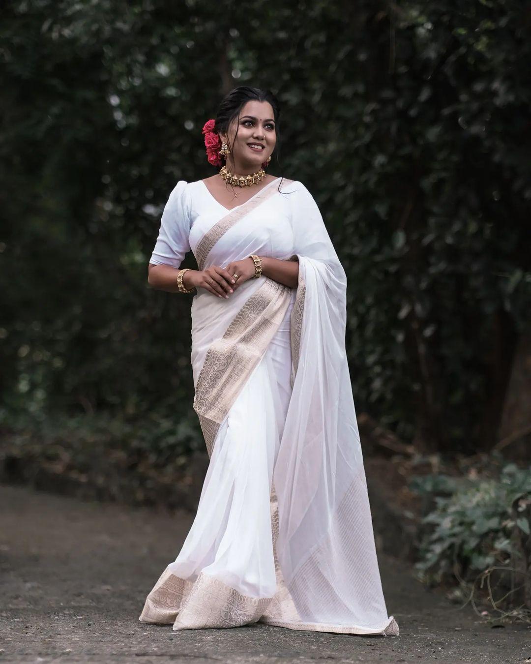 Beautiful and sexy stills | Sruthy Suresh in white saree very glamorous photos