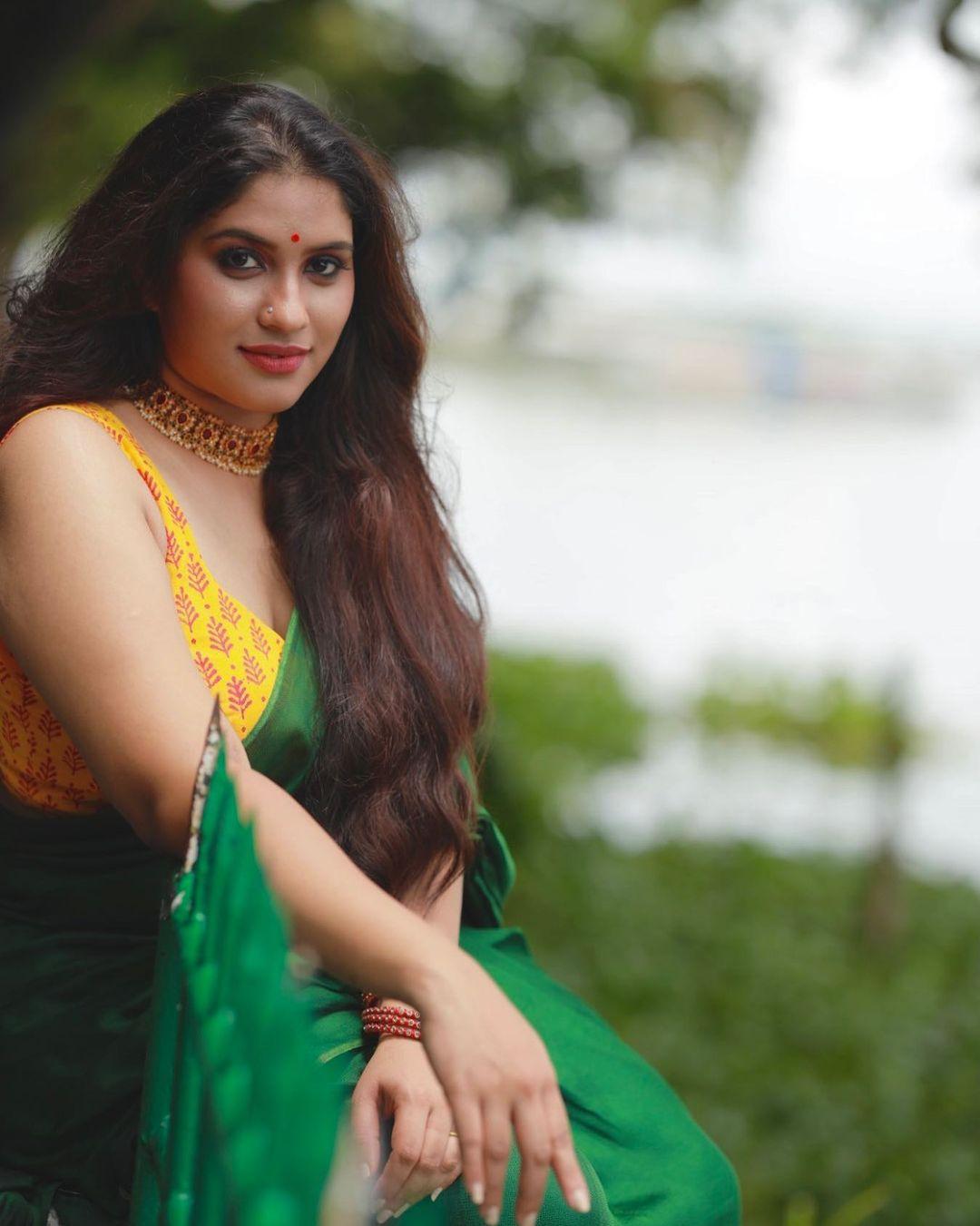 Beautiful and sexy stills | Radhika radhakrishnan in sleeveless blouse and saree hot photos gallery