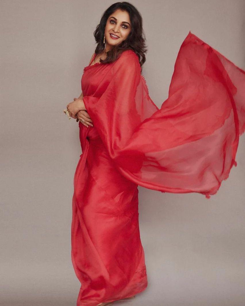 Beautiful and sexy stills | Ramya Krishnan in red transparent saree hot photos gallery