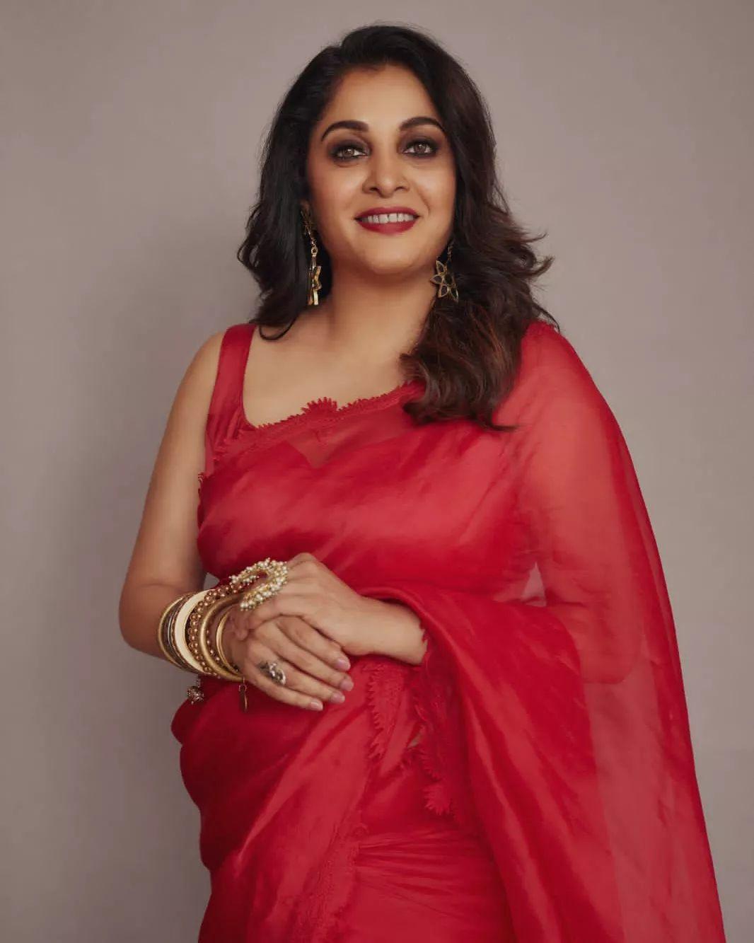 Glamorous and cute picture | Ramya Krishnan in red transparent saree hot photos gallery