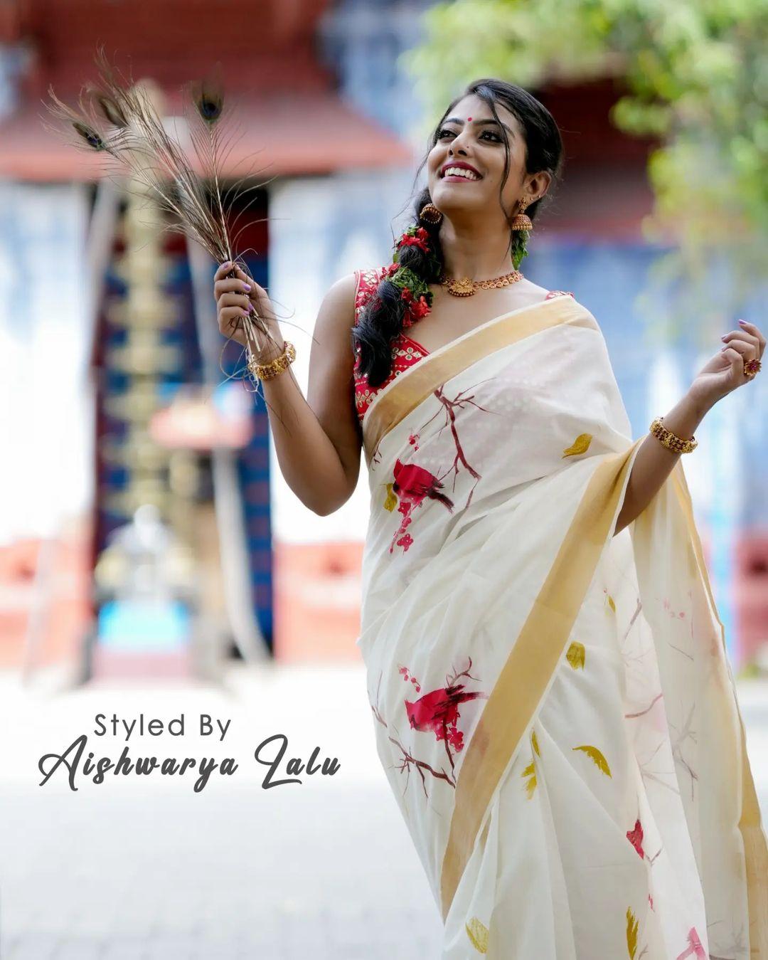 Beautiful and sexy stills | Merin Philip in Kasavu Saree hot and sexy photoshoot