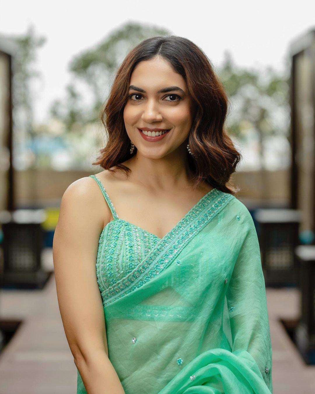 Glamorous and cute stills | Ritu Varma in green transparent saree hot photos gallery